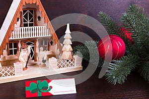 Christmas lighthouse with nameplate and dark wooden background