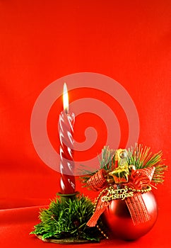 Christmas lighting candle and red ball