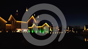 Christmas Lighting Display at a Restored Antique Barns with Trees and Wreaths