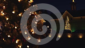 Christmas Lighting Display at a Restored Antique Barns with Trees and Wreaths