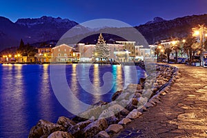 Christmas lights adorning the city center and Torbole Street, View of the beautiful Torbole town by night,Trento,Italy