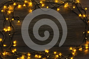 Christmas lights frame on wood grey background