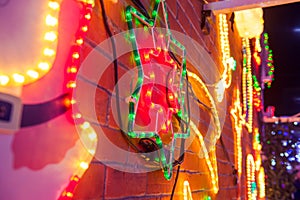 Christmas Lights Background. Nativity star, blurred lights and outdoor decorations. Merry Xmas and New Year outside exterior decor