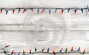 Christmas lights bulb decoration on white wood