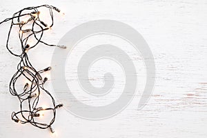 Christmas lights bulb decoration on white wood