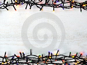 Christmas lights bulb frame decoration on white wood