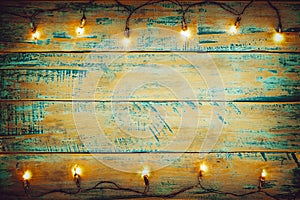 Christmas lights bulb on wood table. Merry christmas xmas background