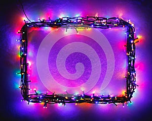 Christmas lights frame on snow background, purple color