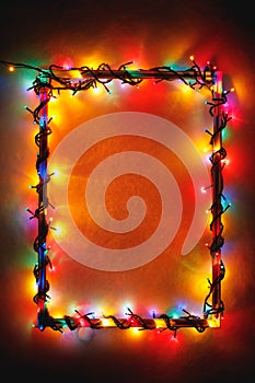 Christmas lights frame on wooden background