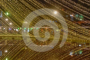 Christmas lights, lake reflect