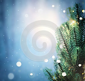 Christmas lights and pine branches and snow. Winter. Christmas. Blue festive winter background