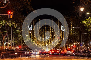 Christmas lights and traffic are seen at night in the city downtown in the Passeig de Gracia main street in Barcelona, Spain on No