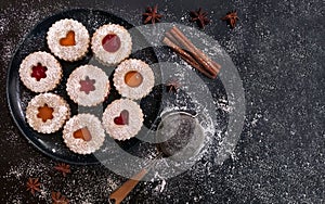 Christmas Linzer cookies on dark background. Top view. Flat lay
