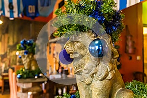 Christmas lion in a hat from pine needles, Prague, Czech Republic