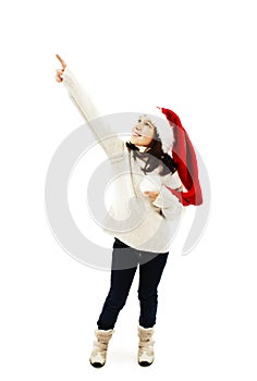 Christmas little girl pointing at copy space standing