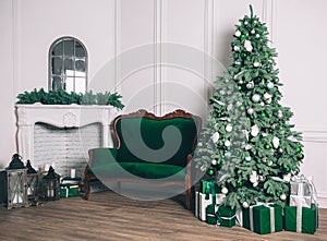 Christmas living room with a fireplace, sofa, Christmas tree and gifts. Beautiful New Year decorated classic home interior. Winter