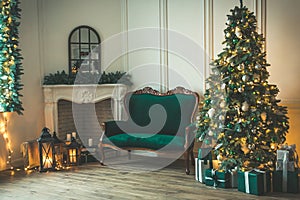 Christmas living room with a fireplace, sofa, Christmas tree and gifts. Beautiful New Year decorated classic home interior. Winter