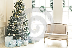 Christmas living room with a fireplace, sofa, Christmas tree, gifts and a large window. Beautiful New Year decorated classic