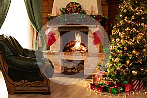 Christmas living room interior in the day time with decorated fireplace, armchair and xmas tree