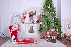 Christmas loft style interior. Soft toy bear on background of Christmas tree .Decorated Christmas room with beautiful tree . New