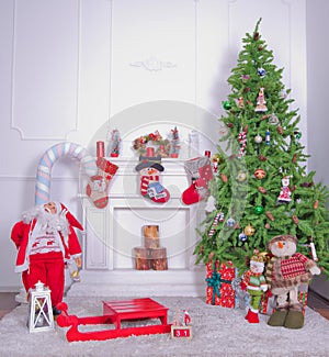 Christmas loft style interior. Soft toy bear on background of Christmas tree .Decorated Christmas room with beautiful tree . New