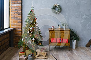 Christmas loft style living room interior. Christmas tree with gifts