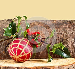 Christmas log, bauble and holly