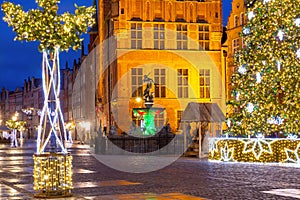 Fountain of Neptune in Gdansk at night, Poland