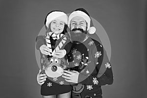 Christmas is love. Little daughter show love heart to father. Bearded man and small child on xmas. Share love and care