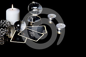 Christmas magical sessions with tarot cards, candle, ring and mirror at night in dark room. Mysterious Christmastide fortune photo