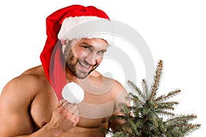 Christmas man standing near the fir-tree isolated on a white background.