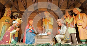 Christmas Manger scene with figurines including Jesus, Mary, Joseph, sheep and magi.