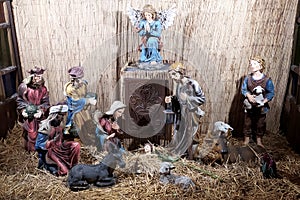 Christmas Manger scene with figurines newborn Jesus, Mary, Joseph