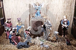 Christmas Manger scene with figurines newborn Jesus, Mary, Joseph