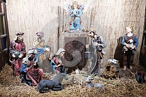 Christmas Manger scene with figurines newborn Jesus, Mary, Joseph