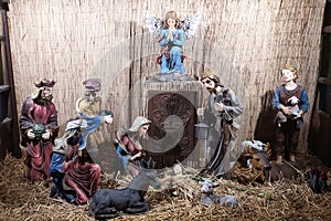 Christmas Manger scene with figurines newborn Jesus, Mary, Joseph