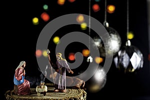 Christmas Manger scene with Jesus, Mary and Joseph with unfocused lights