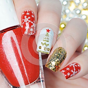 Christmas manicure with snowflakes and christmas tree