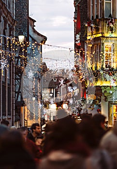 Christmas Market atmosphere in Strasbourg, France people illuminations shopping