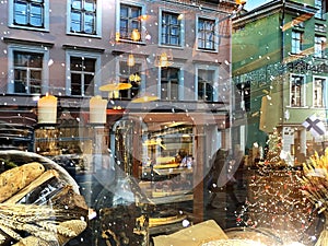 Christmas market in window vitrines trees decoration reflection on street vitrines snowflakes and gold confeti   holiday urban st photo