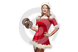 Christmas, x-mas, winter, happiness concept - Bodybuilding. Strong fit woman exercising with dumbbells in santa helper