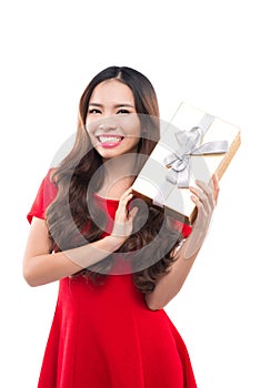 Christmas, x-mas, winter, happiness concept - smiling woman in red dress with gift box