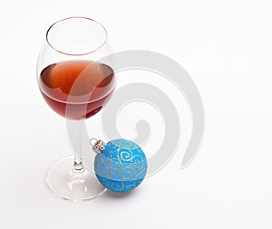 Christmas menu concept. Winter celebration with alcohol drink. Glass with wine and christmas decoration. Wineglass with