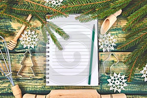 Christmas menu plan or recipe on green rustic wooden background