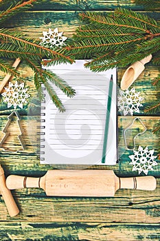 Christmas menu plan or recipe on green rustic wooden background