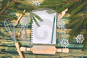 Christmas menu plan or recipe on green rustic wooden background