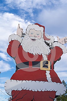 Large Santa Claus outside of the North Pole Santa`s Workshop store