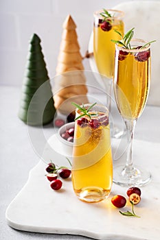 Christmas mimosas with apple cider and champagne or sparkling wine, festive Christmas cocktails