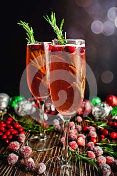 Christmas Mimosas Garnished with Sugared Cranberries and Rosemary