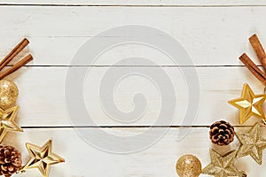 Christmas. Mockup christmas. Top view of gold christmas items cinnamon stars cones